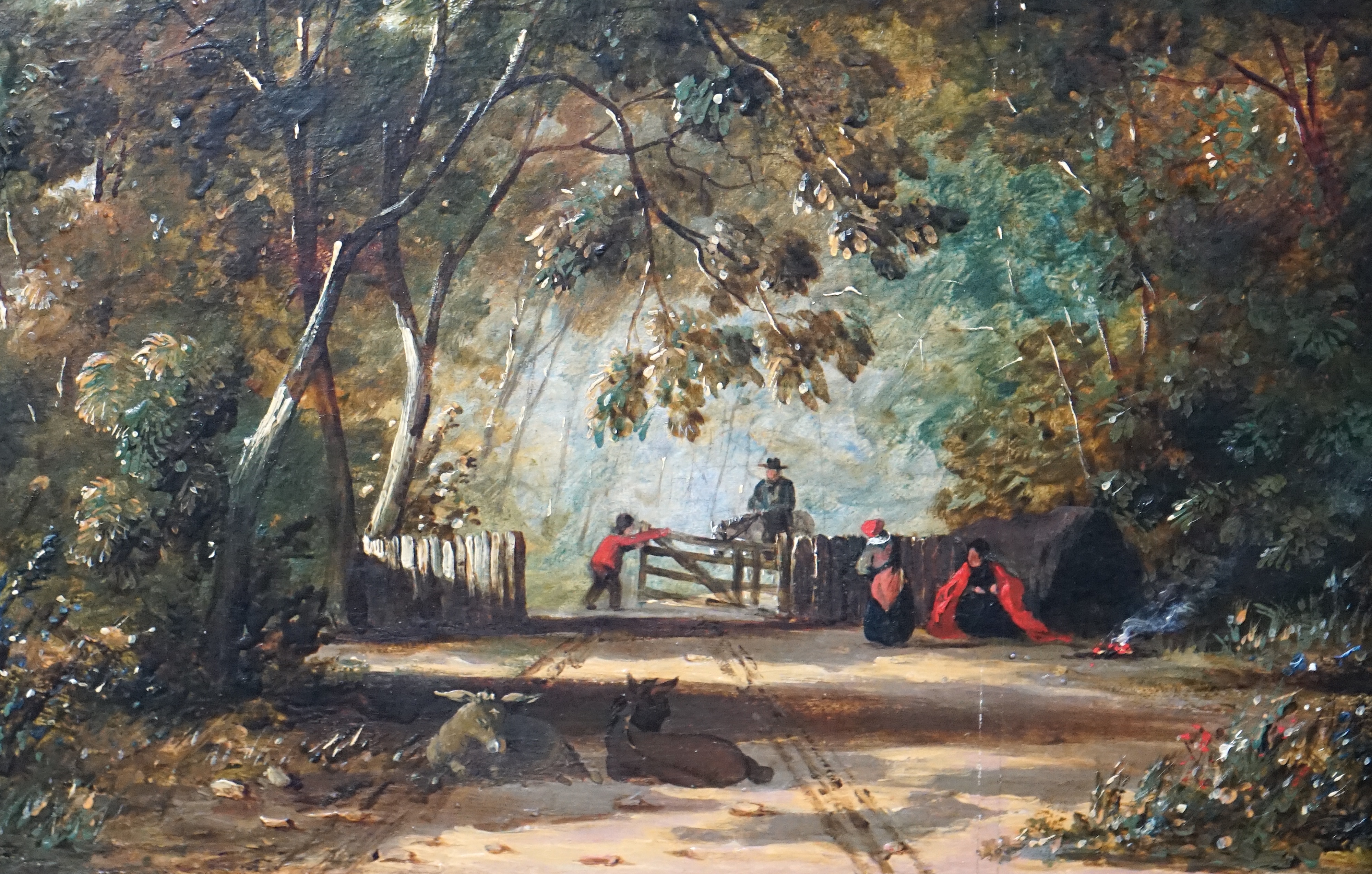 Attributed to John Linnell (English, 1792-1882), oil on oak panel, Wooded clearing with travellers and donkeys, 21 x 30cm. Condition - good